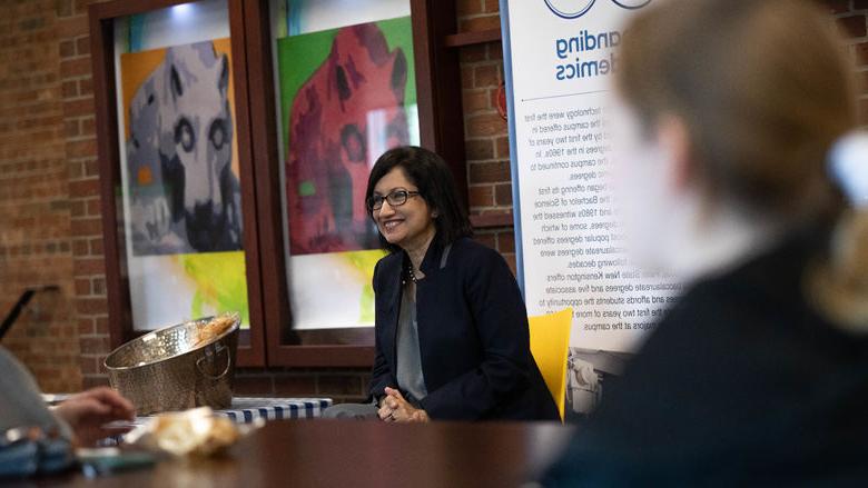 President-elect Neeli Bendapudi smiles with students