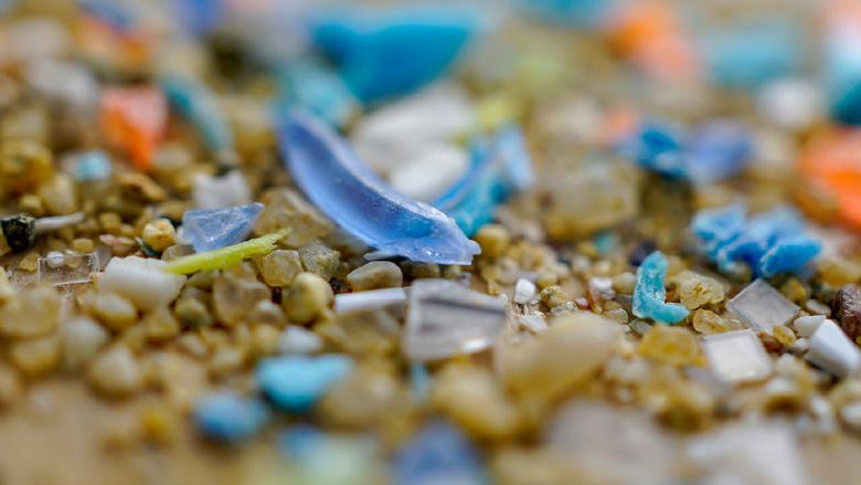 microplastics mixed among sand sediment